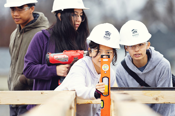 Students participate in a service project at a community site.