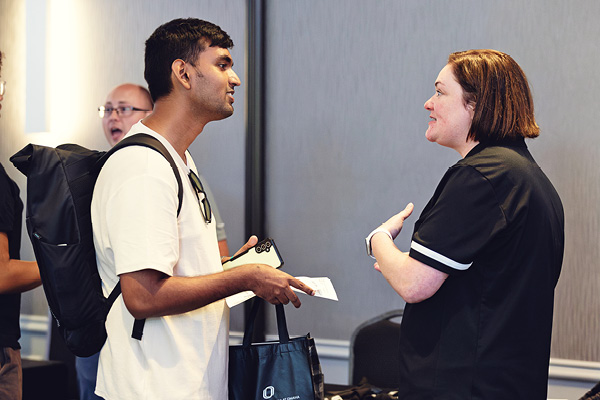 A graduate ambassador talks with prospective students during a campus visit.