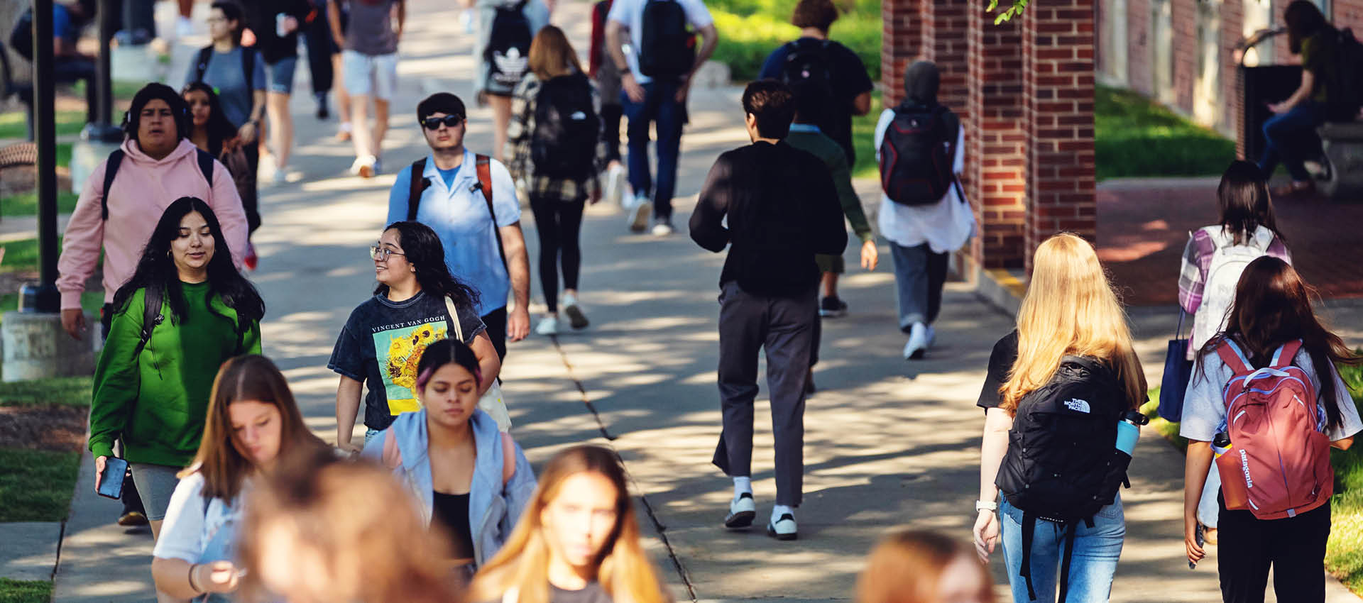 Students walk across campus during a busy class change.