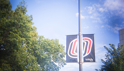 uno banner on a light pole.