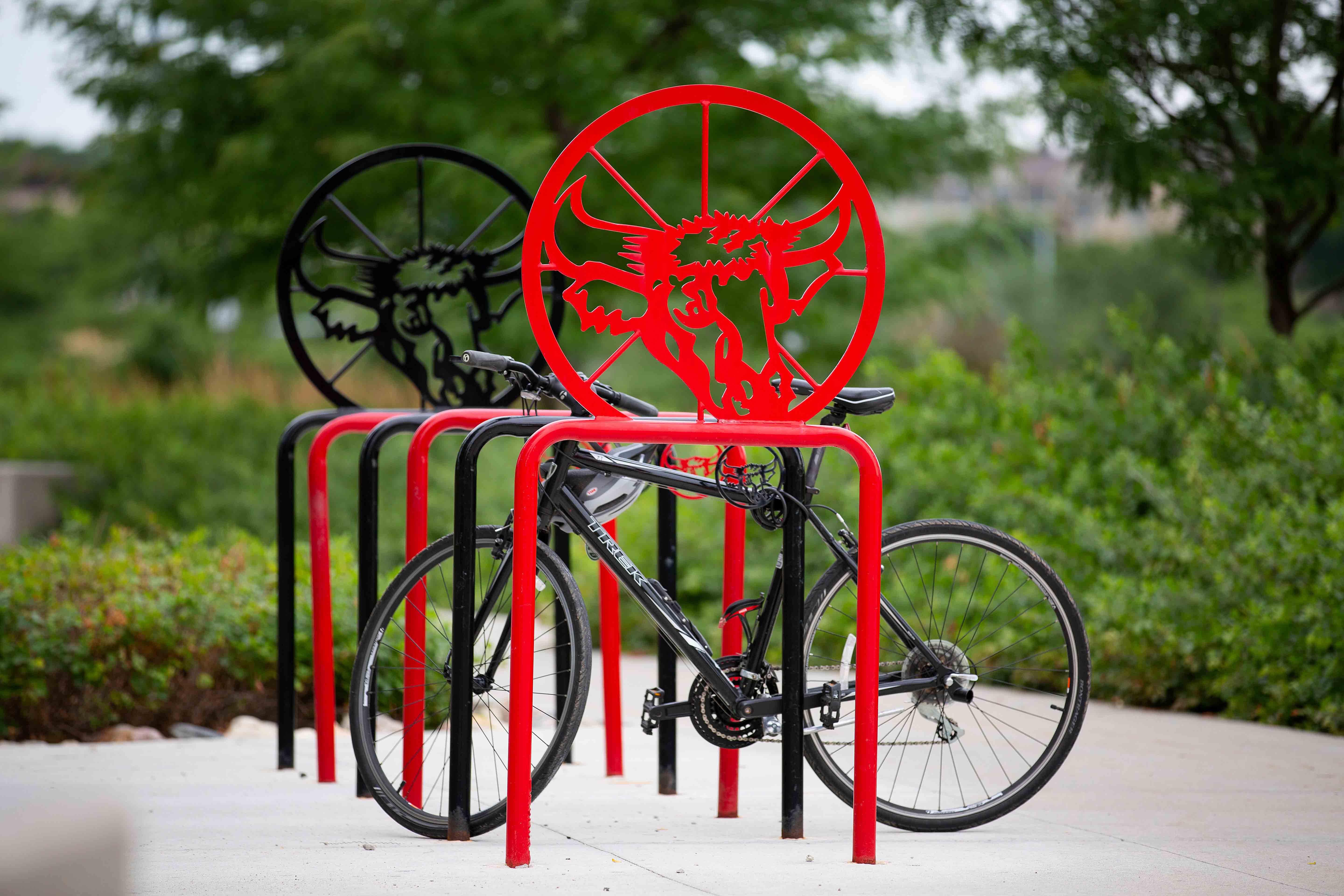 Picture of parked bicycle in a bicycle rack.