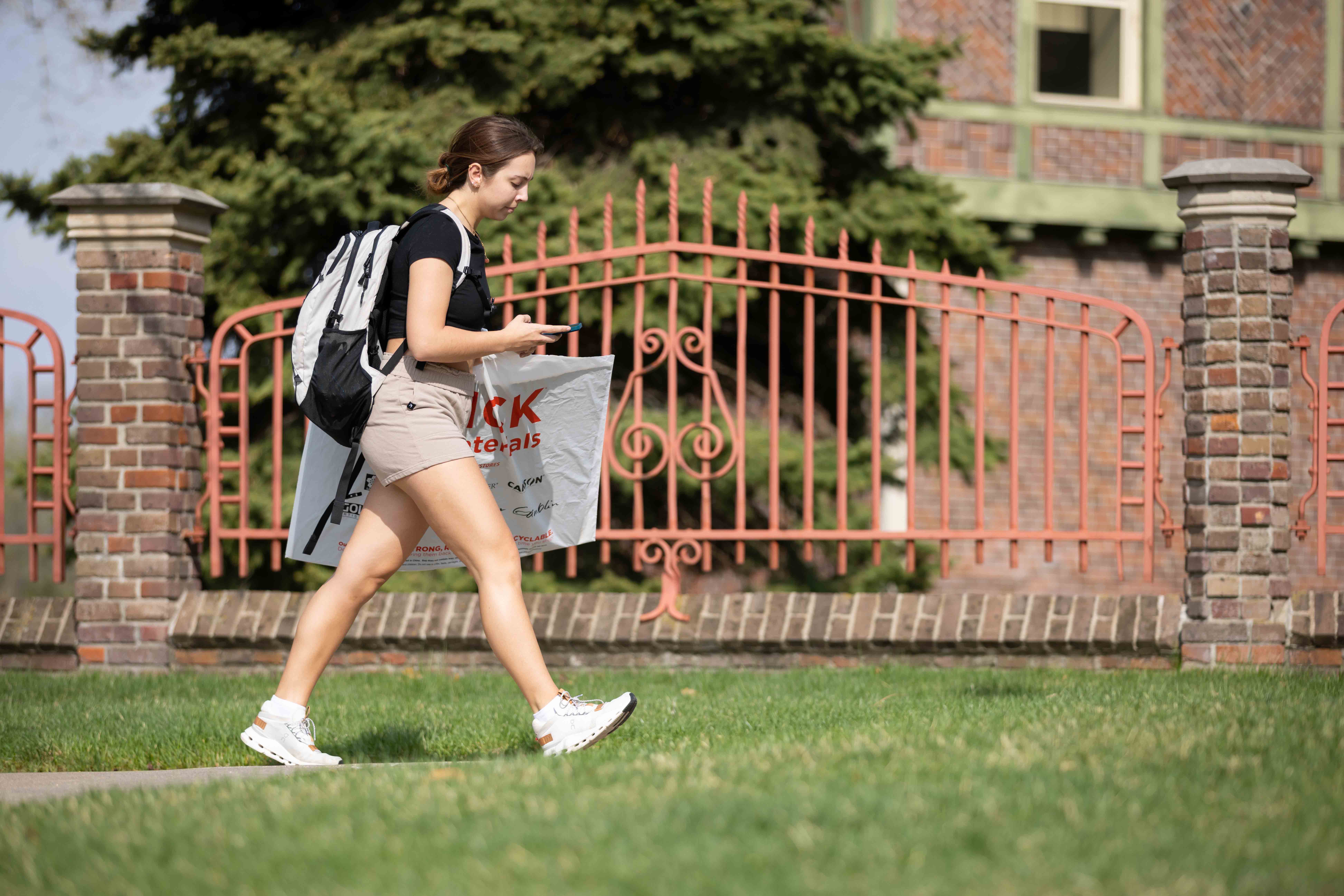 Picture of student walking on campus.