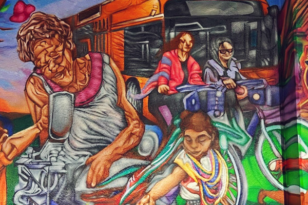 A mural depicting community life in Omaha.