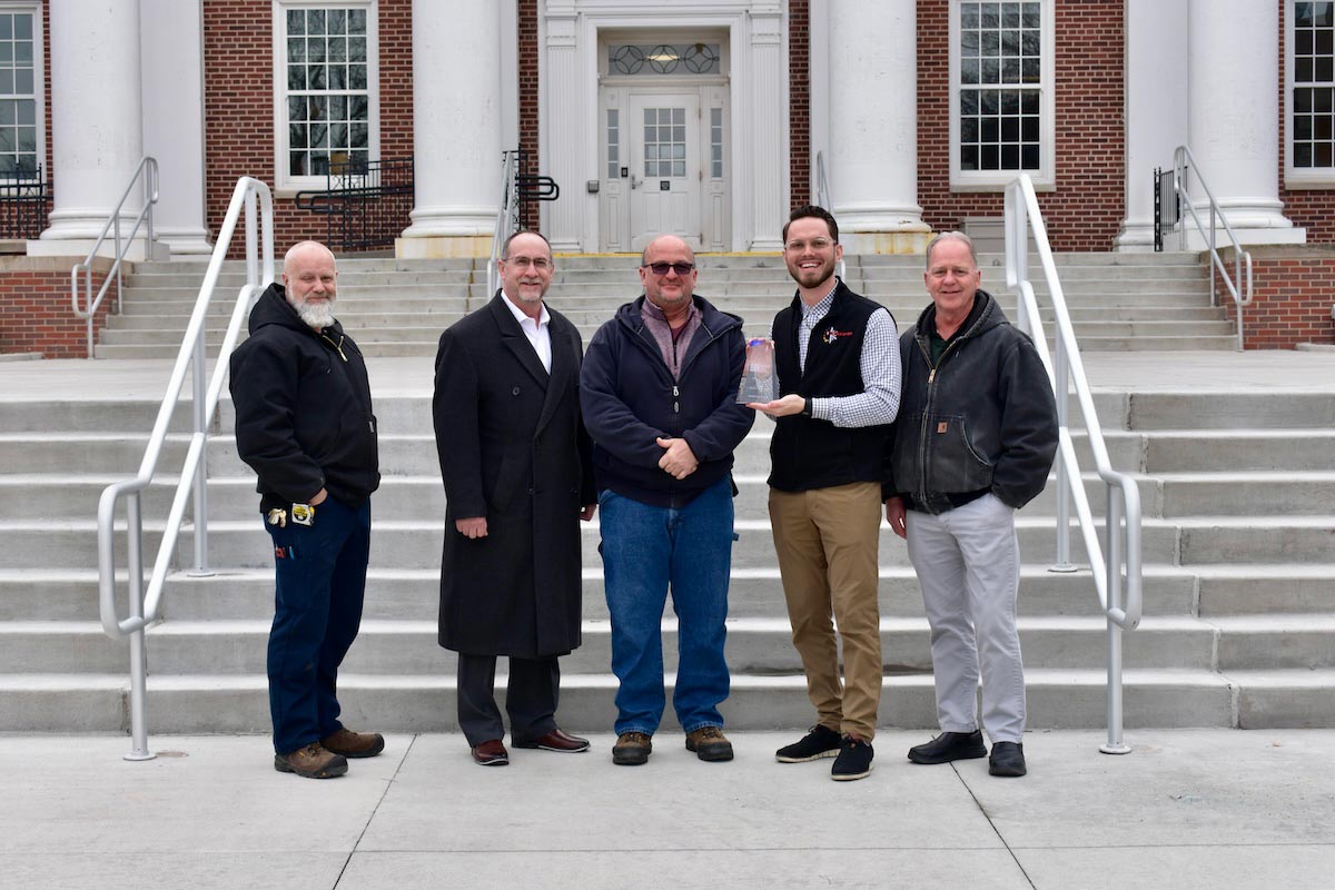 University of Nebraska at Omaha Facilities staff are presented with the NAFA Clean Air Award. Pictured left to right: Marc Elder, UNO Facilities maintenance supervisor; Larry Morgan, UNO Facilities director; Tom Wawrzynkiewicz, UNO Facilities chief engineer; Kaleb Betzold, The Filter Shop, Inc., and Dave Meradith, UNO assistant facilities director. Photo: Kaleb Betzold, The Filter Shop, Inc.