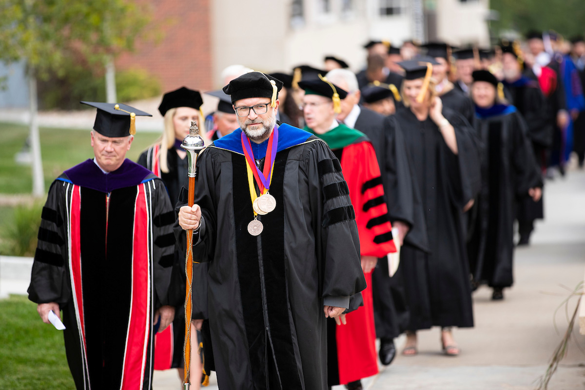 Nikolaos Stergiou, Ph.D. marshals the platform party from the Milo Bail Student Center to the Strauss Performing Arts Center for the investiture of Jeffrey P. Gold, M.D., as UNO’s chancellor in 2019.