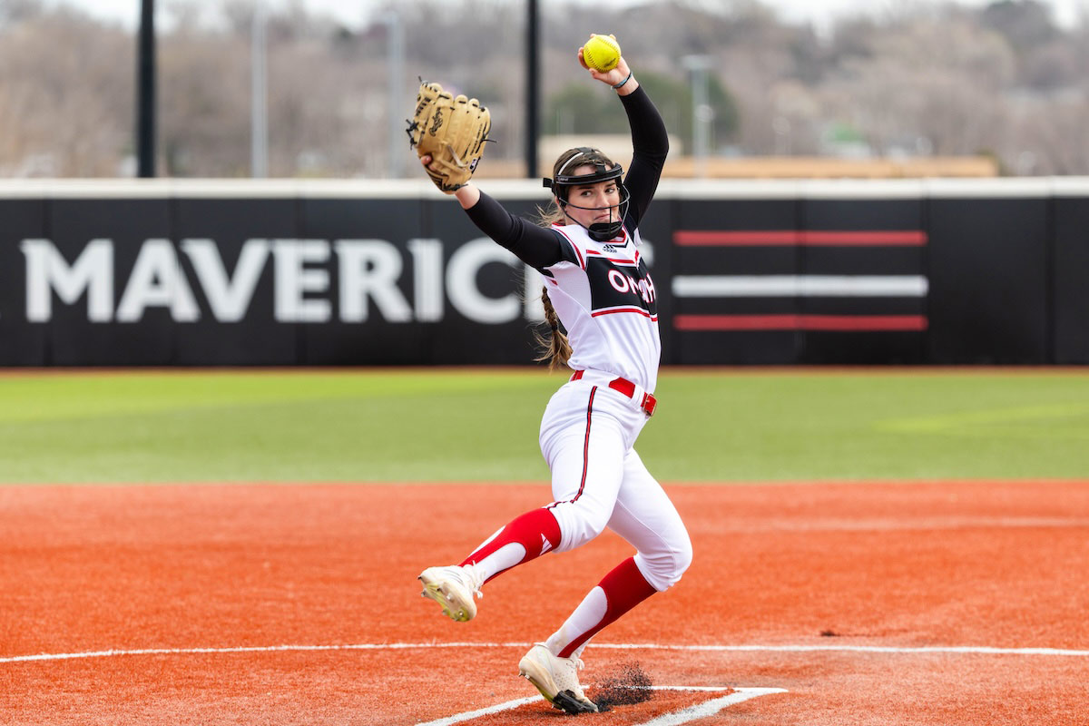 A softball pitcher from the University of Nebraska at Omaha prepares to throw a pitch during a game at Connie Claussen Field.