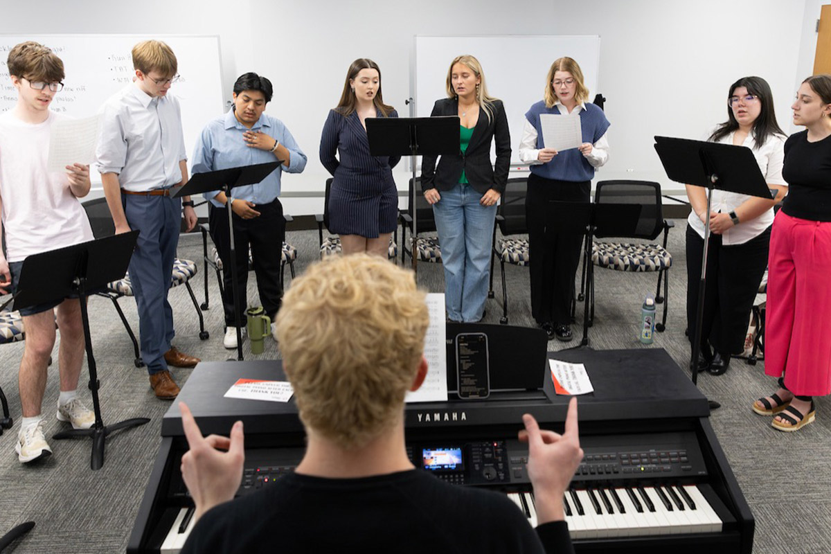 One Note Stands, UNO’s a cappella student organization, rehearses for its spring show. Photo: Strategic Marketing and Communications, Ryan Soderlin.