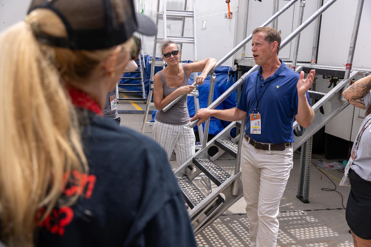 UNO students and faculty explore ESPN's production trucks during the Men's College World Series, learning about the technology and teamwork behind live sports broadcasts. Photo: Jeremy Chretien, Office of Strategic Marketing and Communication.