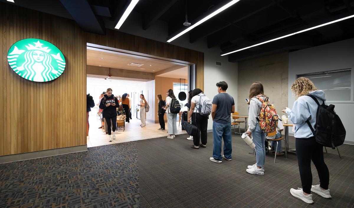 Students stand in line outside Starbucks in Criss Library during Coffee Talk with Spirit and Tradition, where they received vouchers and met Chancellor Joanne Li.