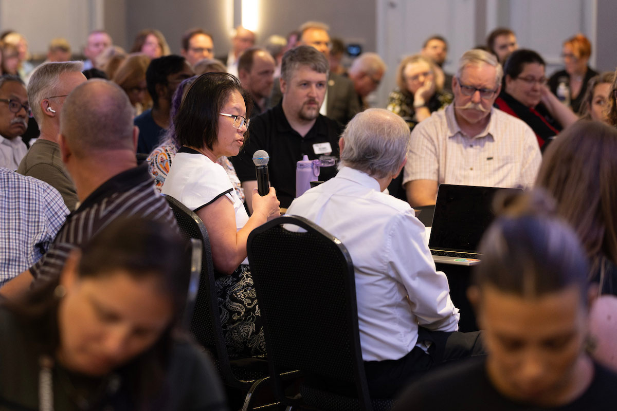 Patty Bick, Ph.D., asks a question during the forum.