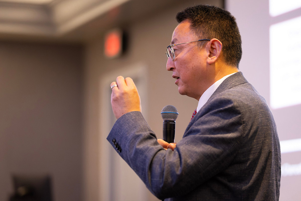 Phil He, Ph.D., speaks during the forum.