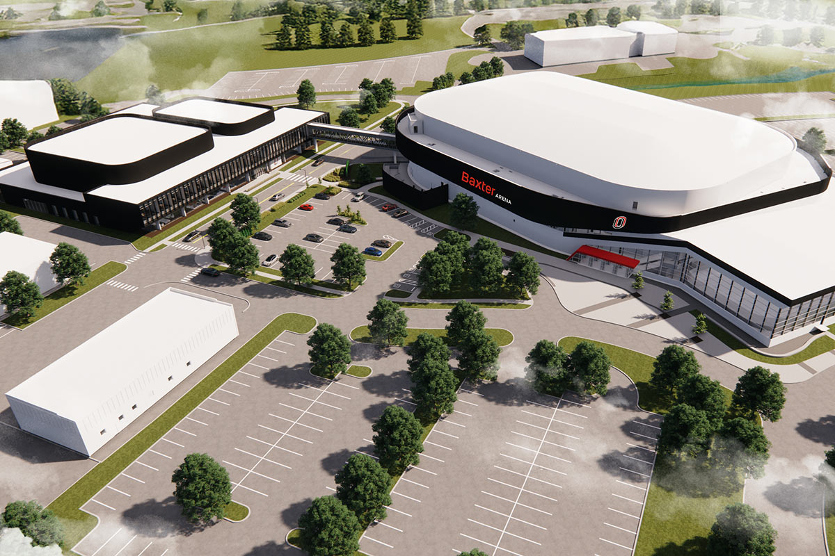 A bird’s-eye view shows Baxter Arena connected to a neighboring facility, surrounded by parking lots and trees.
