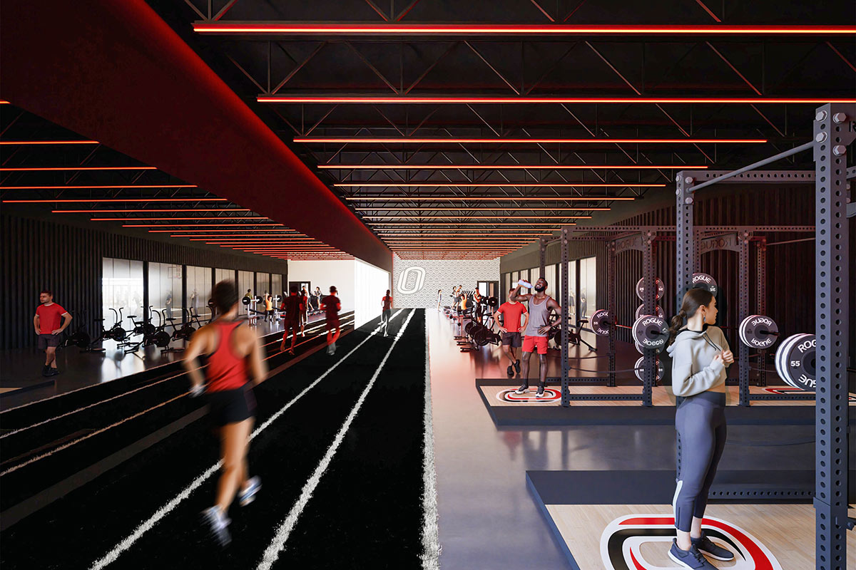 Athletes run on an indoor track and exercise in a weight training space illuminated with red accent lighting.