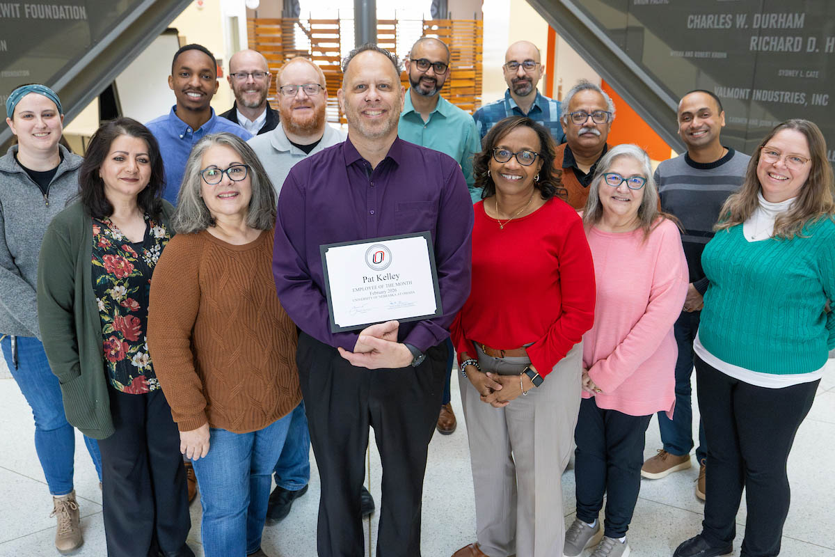 Pat Kelley celebrates his award with his colleagues.