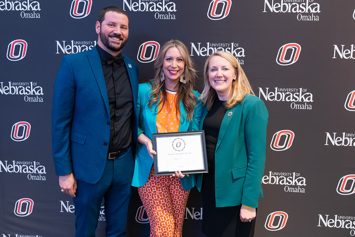 Angie Centarri poses with her certificate with two other individuals.