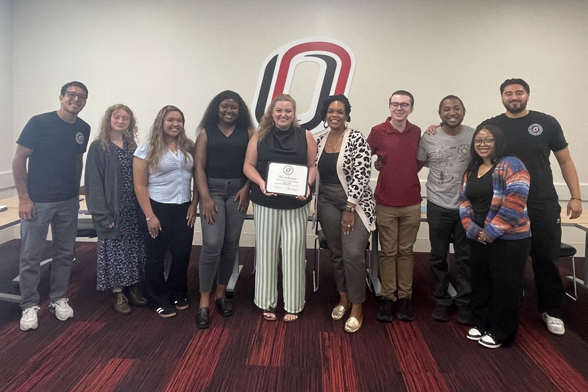 Olivia Kenny poses with her colleagues from the Office of Student Leadership and Involvement.