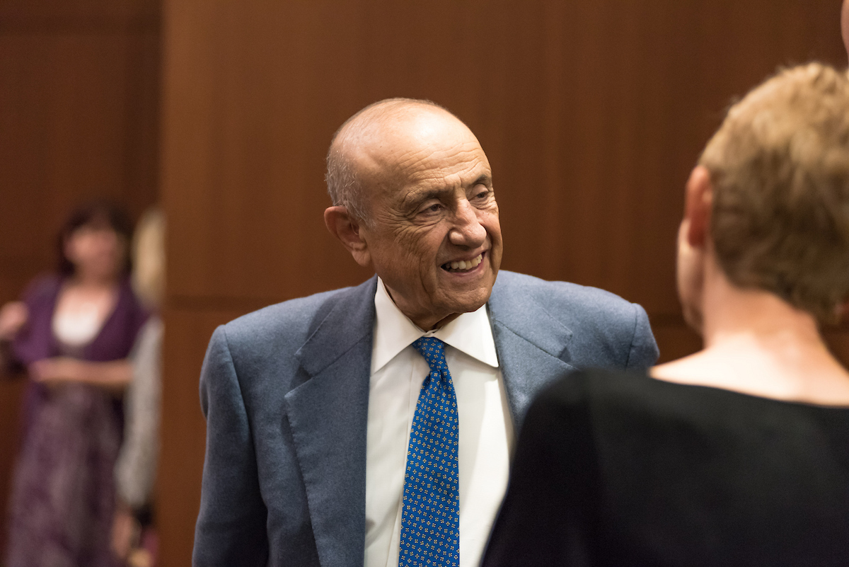 Michael B. Yanney converses with an event attendee