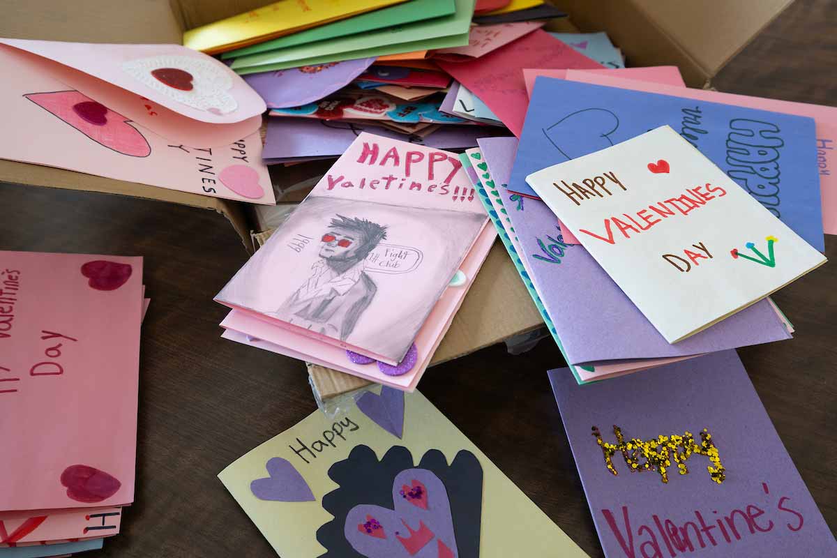 A group of decorated cards with Valentine’s Day messages and decorations 