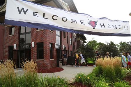 Welcome banner for students. With students in the background.
