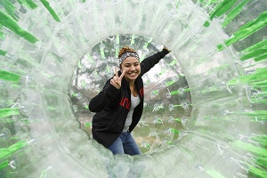 Student inside of a giant bubble ball.