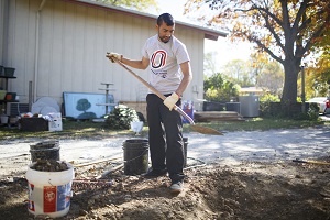 Student with a shovel.