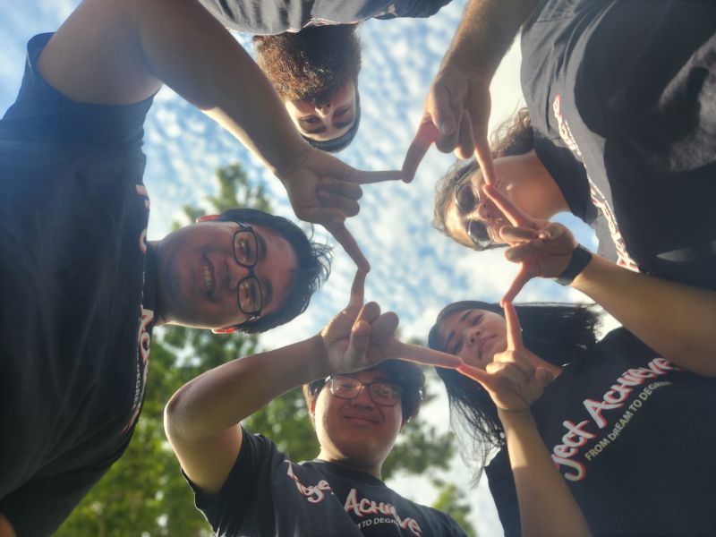 Five people looking at the camera.