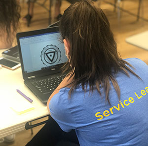 a student works on a laptop.