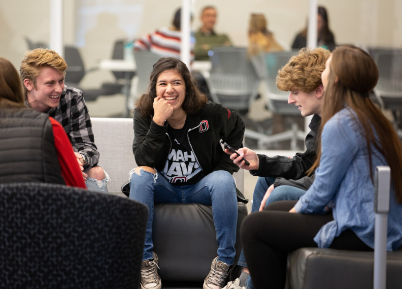 students conversing in atrium 