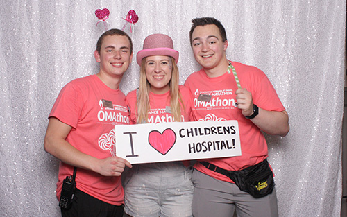 Dance Marathon participants hold a sign that reads "I love Childrens Hospital"