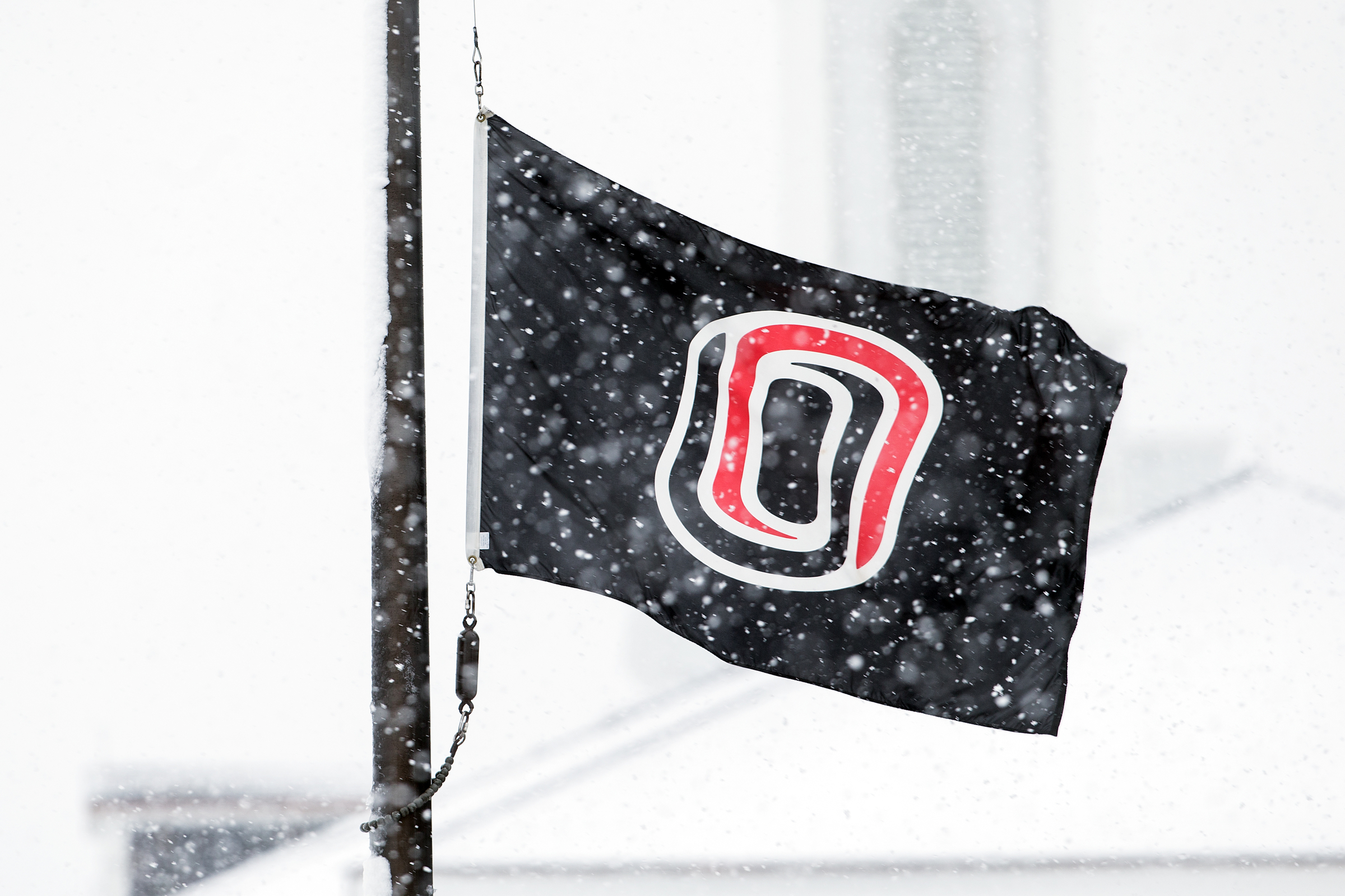 "o" flag flying in winter.