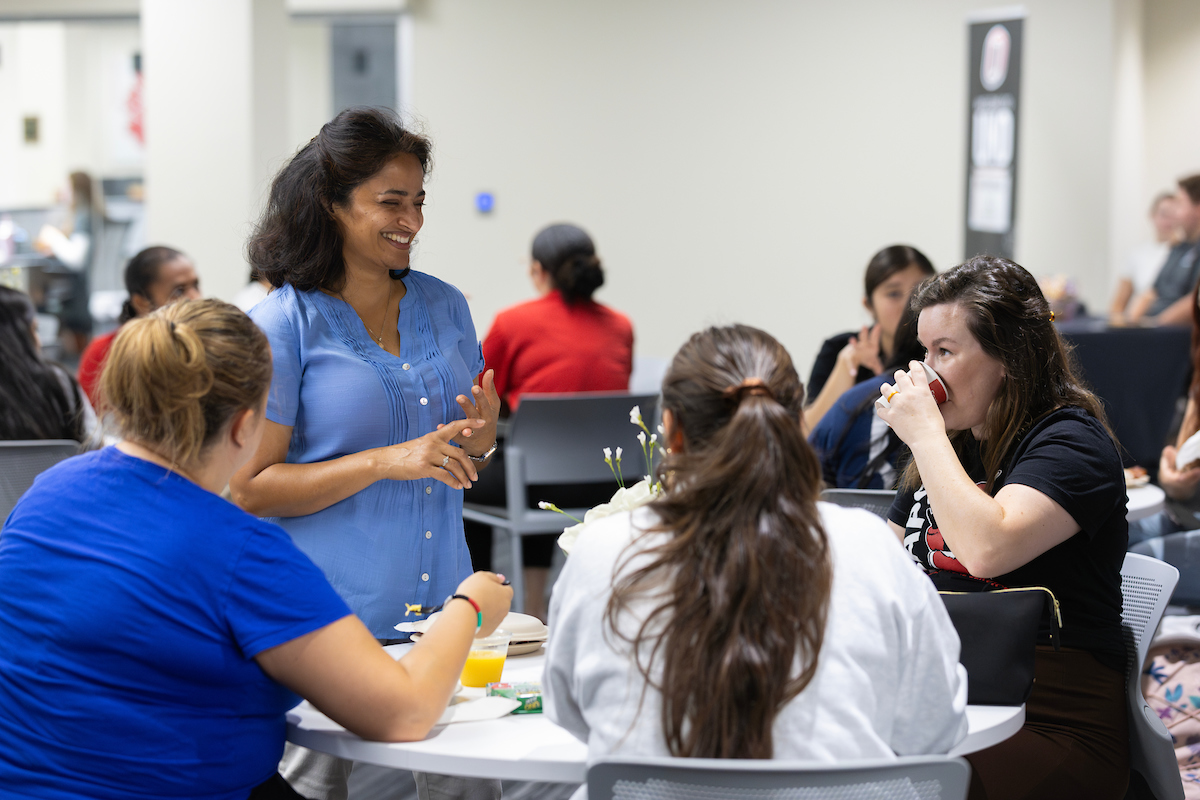Staff eating and chatting.